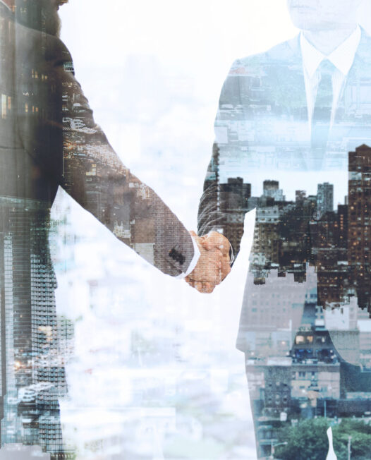 Corporate business handshake between business partners Corporate business handshake between business partners